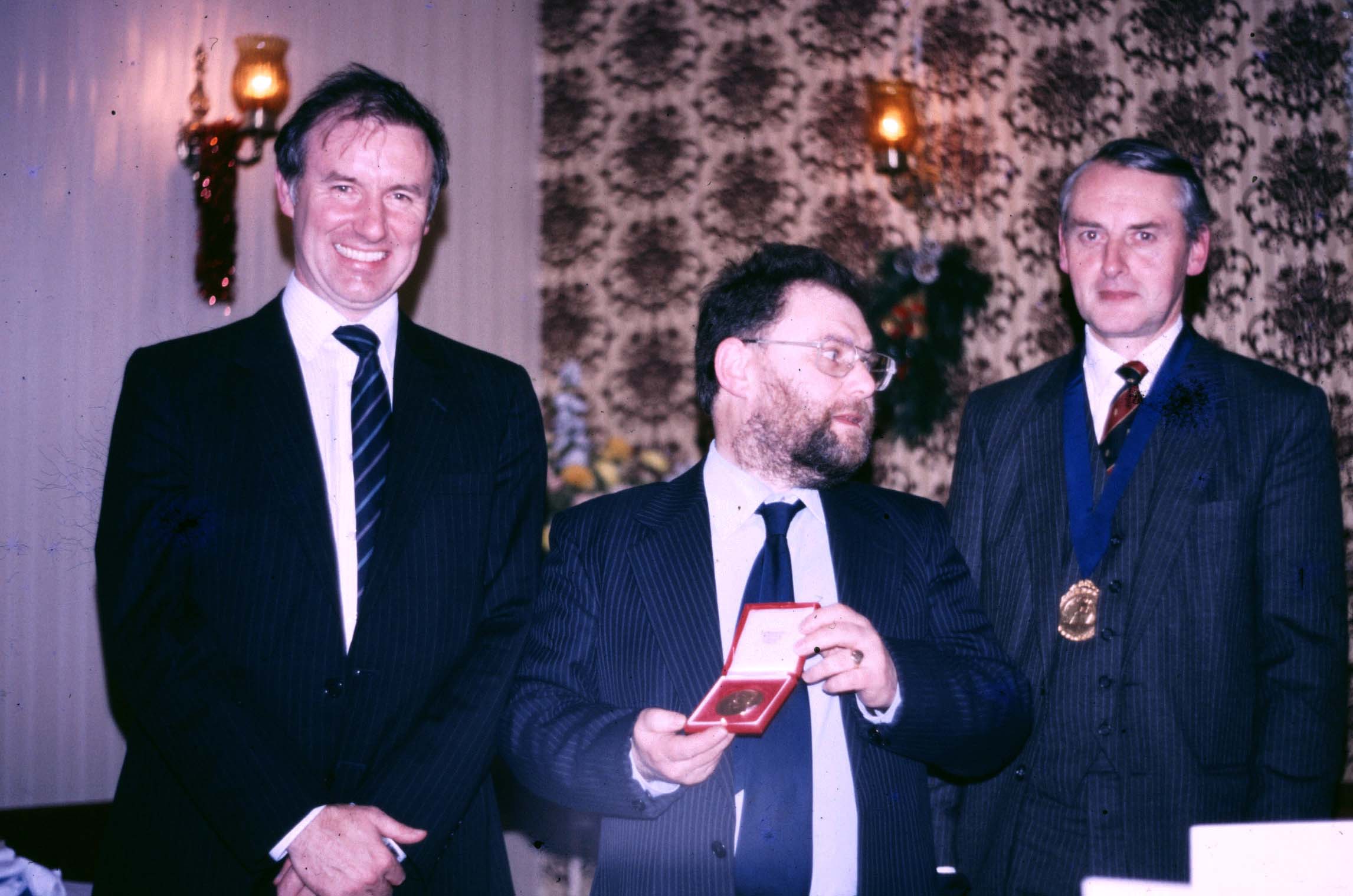 1985  Harry receives the Lorimer medal here with Malcolm Longair and Dave Gavine 